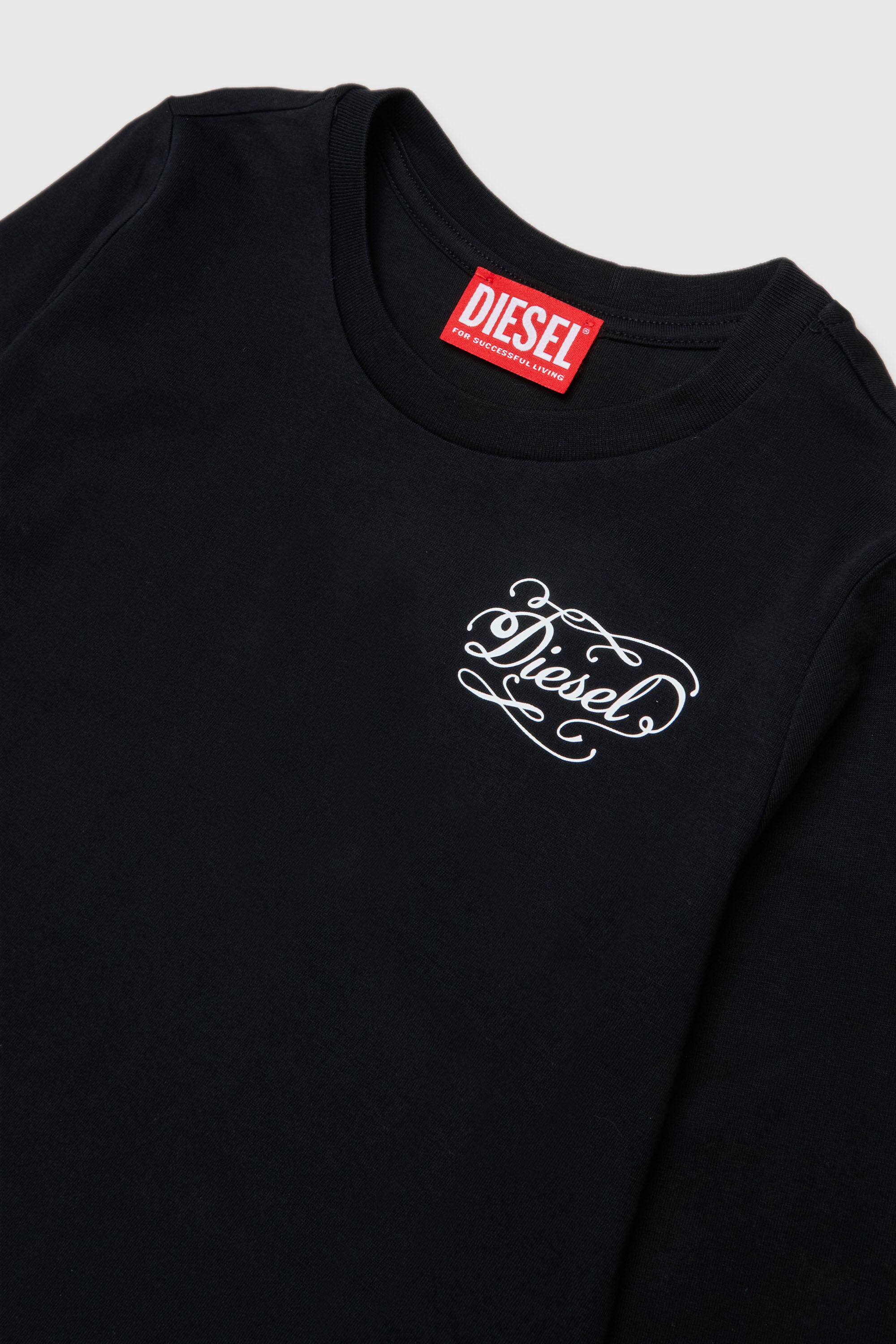 Diesel - TORSY, Woman's Long-sleeve T-shirt with whimsical logo print in Black - 3